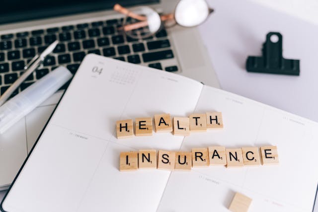 Scrabble tiles spelling health insurance representing united healthcare short term health insurance options