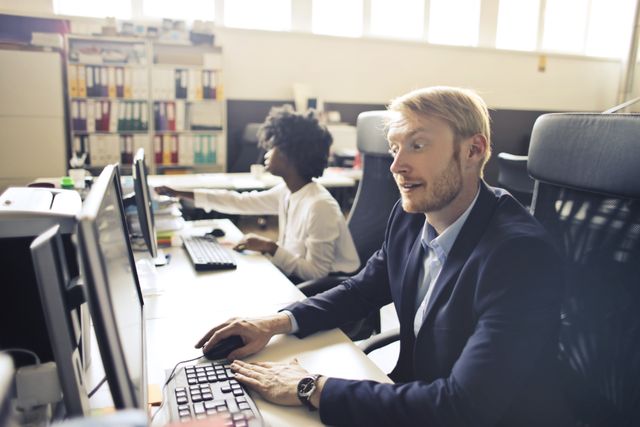 Professional reviewing health coverage options online to avoid a lapse in health insurance between jobs penalty