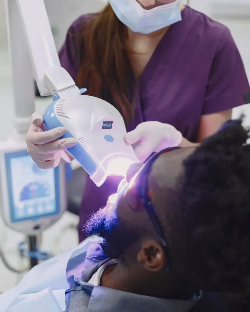 Dentist treating a patient in a Texas clinic, the routine care the best dental insurance in Texas is chosen to cover