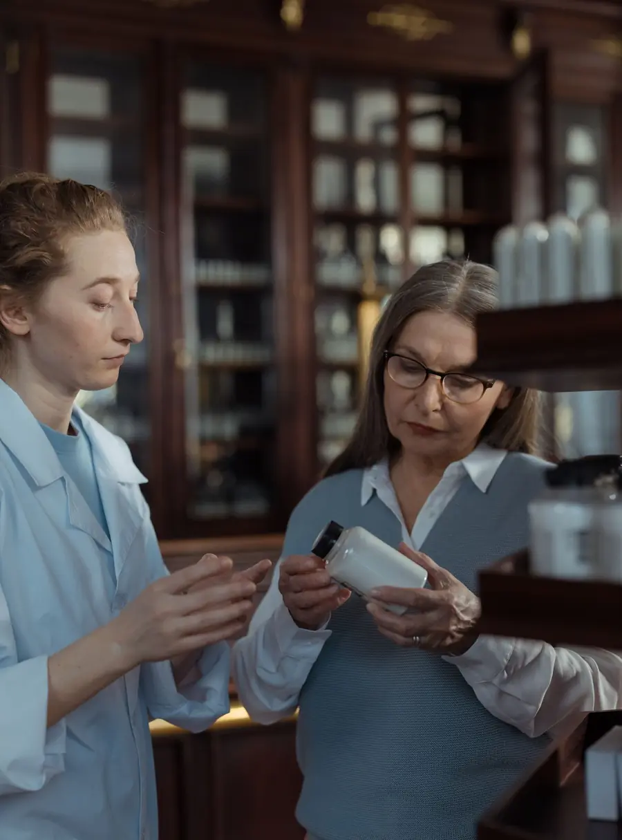 Pharmacist and patient showing referral and network rules on a Blue Cross Blue Shield Texas PPO