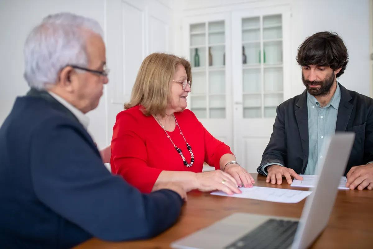 Licensed Texas broker reviewing an HSA insurance plan with a couple before they enroll