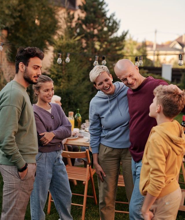 Multi-generational Texas family enjoying gathering, covered by group health insurance