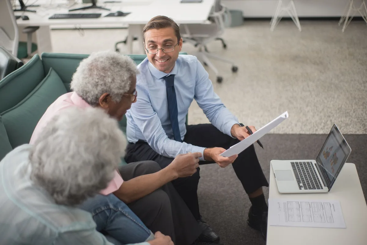 Broker comparing Texas health insurance plans from top carriers with clients