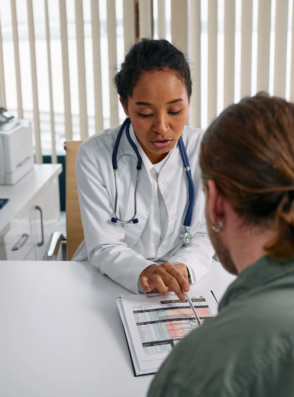 Doctor and patient checking the provider network on a Texas individual health insurance plan