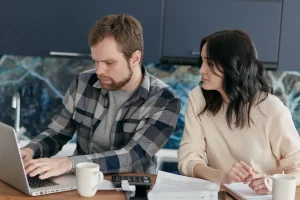 Texas couple comparing plans before opening a health savings account Texas residents can use
