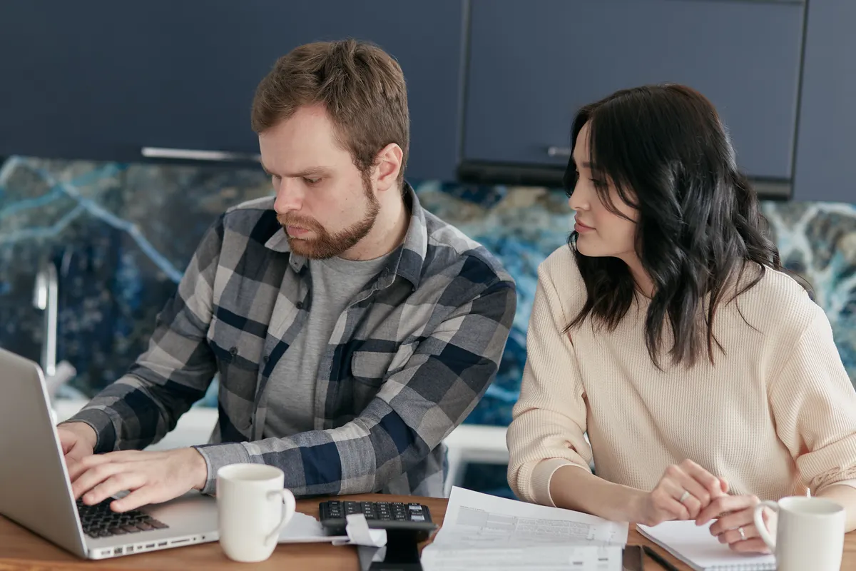 Texas couple comparing plans before opening a health savings account Texas residents can use