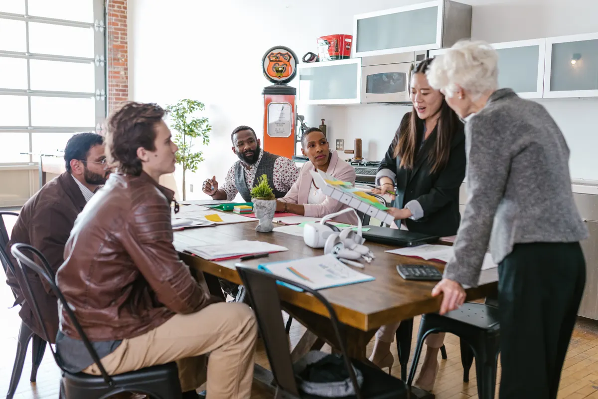 Texas employer explaining a small business HSA to the team around a meeting table