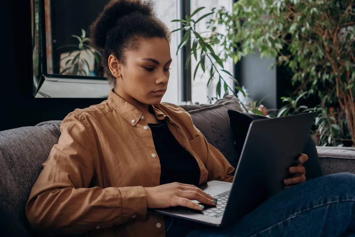 Texas woman on her laptop researching how to get health insurance outside of open enrollment