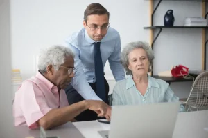 when does open enrollment end: Texas couple comparing health insurance plans with a broker before the deadline