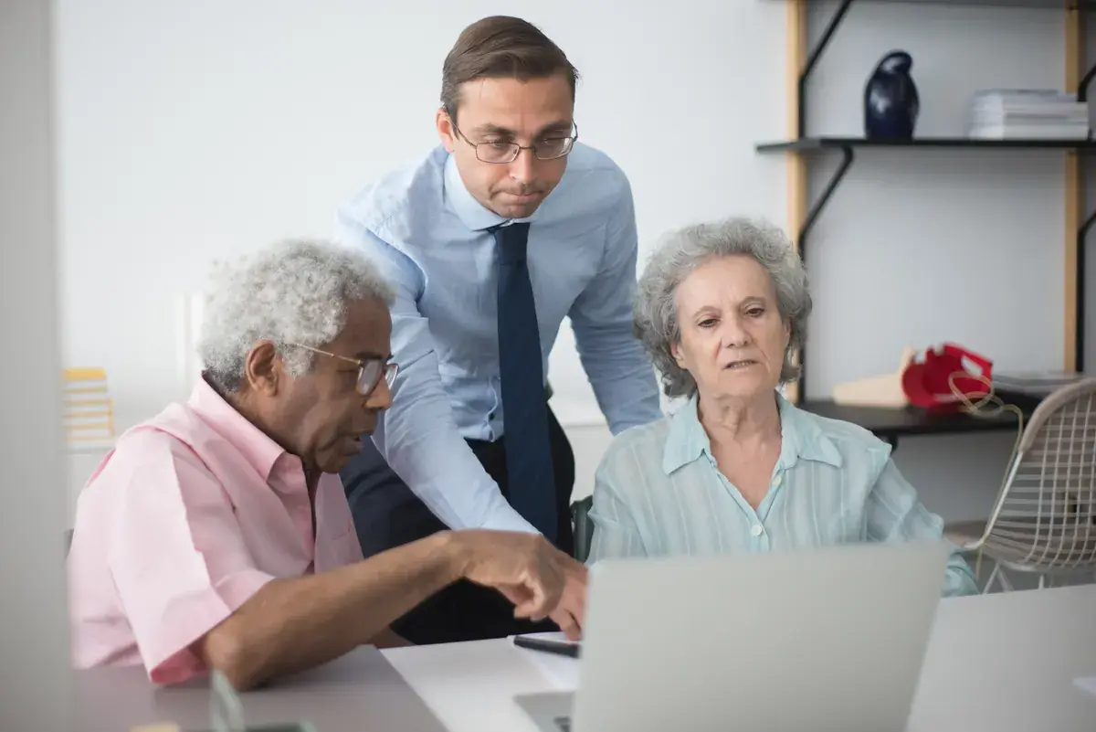 when does open enrollment end: Texas couple comparing health insurance plans with a broker before the deadline