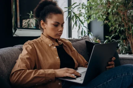Texas woman on her laptop researching how to get health insurance outside of open enrollment