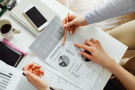 HSA vs FSA vs HRA comparison reviewed with a calculator and account paperwork
